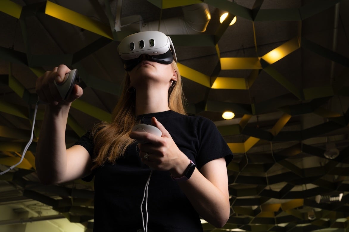 A woman wearing a virtual reality headset